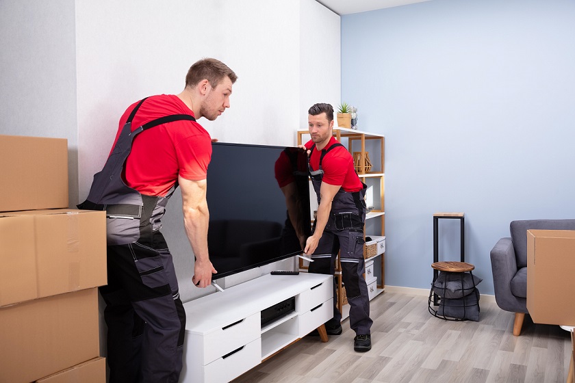 Full-service movers unpacking in a home