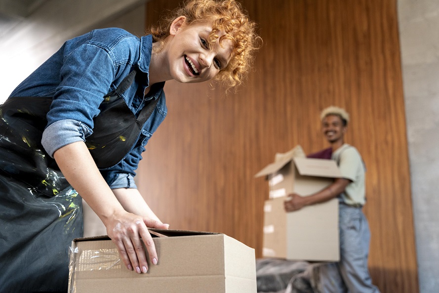 Vancouver apartment movers wrapping furniture in hallway